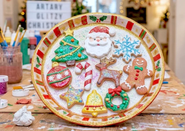 Christmas clay platter with sculpted Santa, tree, star and gingerbread decorations.